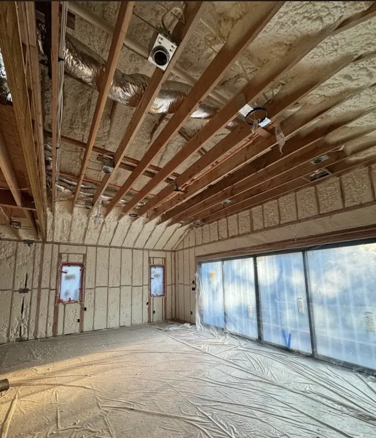 Interior walls and ceiling insulated with spray foam during new construction in North Kensington